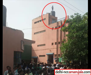 high voltage drama, the young man climbed on the tank