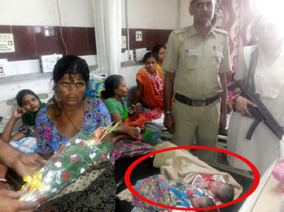 The woman was holding the gun helped in little angel born in moving PCR.