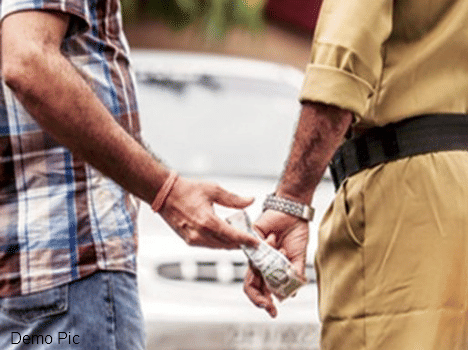 Suspendee policemen recoverd bribe by showing the uniform.