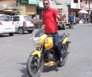 naveen karki took risk on bike riding in hilly roads.