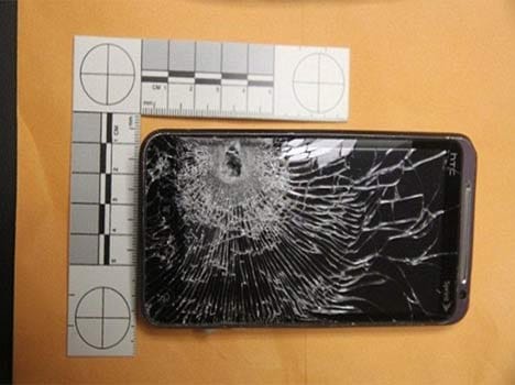 A store clerk was saved from a bullet by his mobile phone