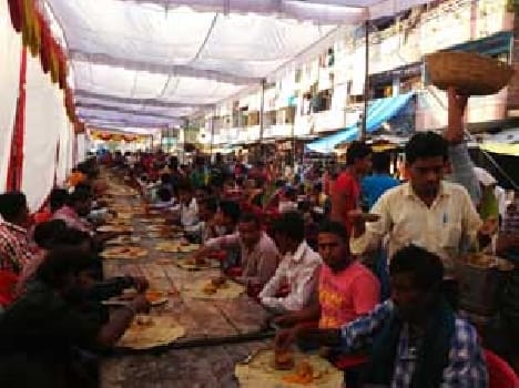 people  took  Prasad in Bhandara