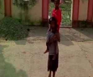 girl walks 8 km carrying her brother on shoulder to treatment in hospital