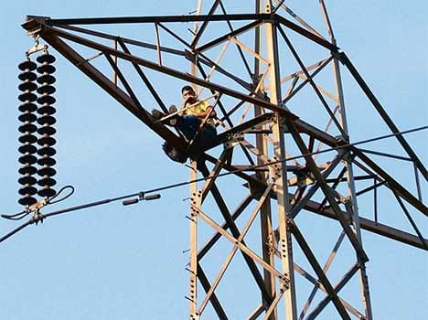 man climbed at electric tower for demand to reduce wine rate