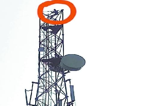 The young man climbed on mobile tower