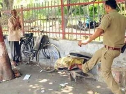 A Police man misbehaved with an old man.