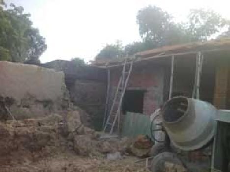 The wall collapsed, killing two workers, a serious