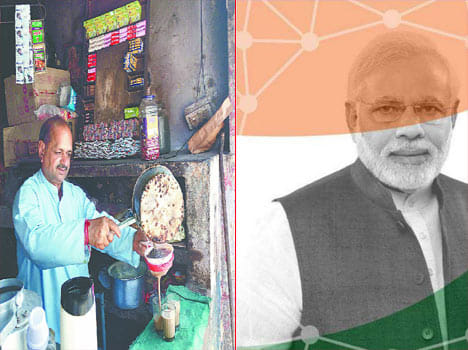 Tea man son with PM Modi in Digital India campaign.