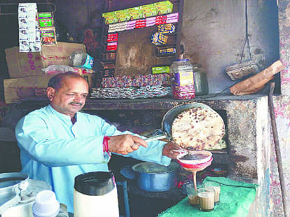 Tea man son with PM Modi in Digital India campaign.