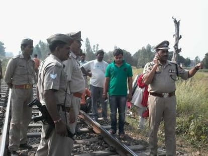 A train runs over a damaged track.