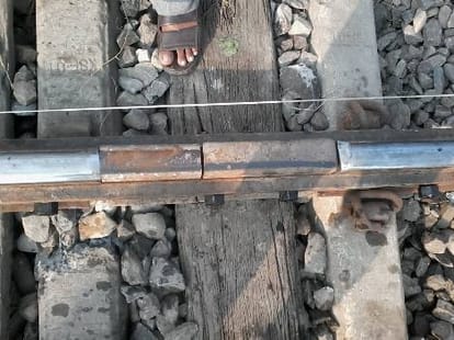 A train runs over a damaged track.