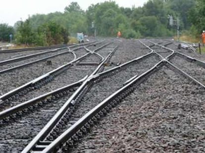man talking on phone reached on track and train hit.