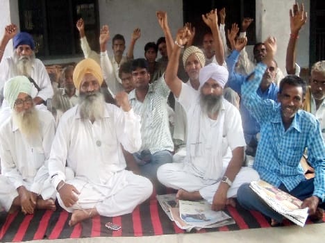 BKU activists encompass not purchase paddy at the start