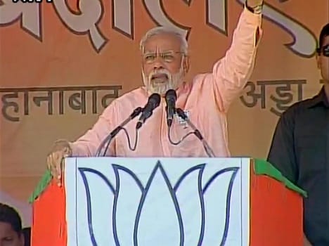 People throw chairs during Darbhanga rally of PM Modi