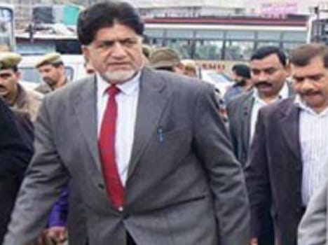 transport minister charged with possession of government land