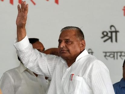 Mulayam Singh speaks to young party leader.