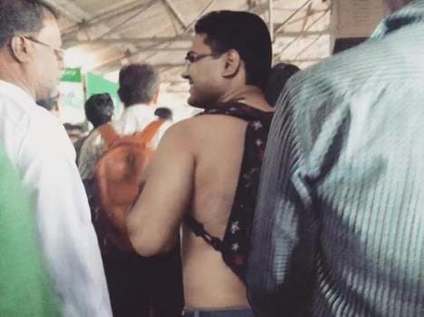 Guy parades shirtless after team India' s victory in Indore