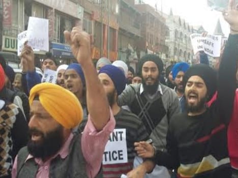 jammu kashmir sikh group protests granth sahib's desecration