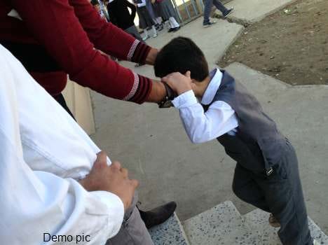 teacher misbahaved with student in morning prayer.