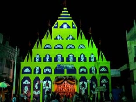 Vedic mantras , blowing wake up between the Durga Puja stalls