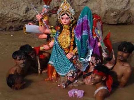 The devotees sing and dance farewell to mother