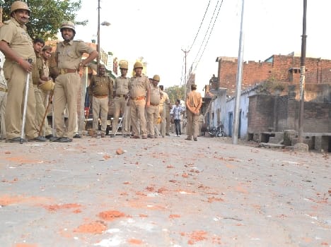 Fiercely between two communities Physical , brick - stone walk