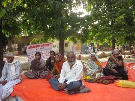 Women with a family sitting on hunger strike