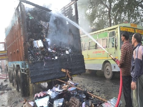 Truck fire, burning millions of goods