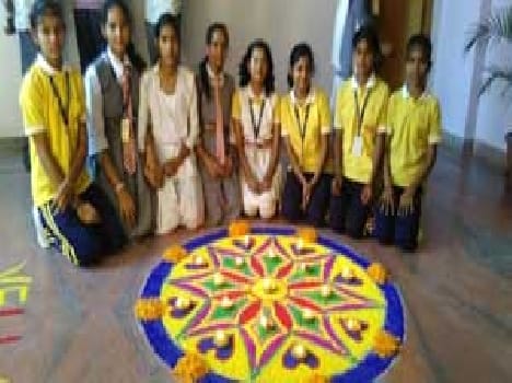 Rangoli Restaurant in the green and deep yellow house first