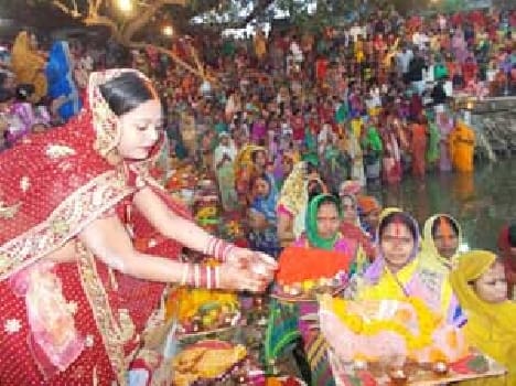 The devotees were passing through the rising water to Sun