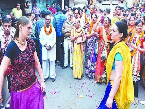 The city derived procession chanting Radha Madhav