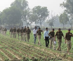 stampede on police team during raid