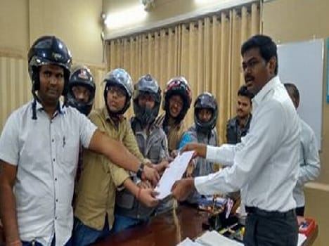 Media wearing a helmet display