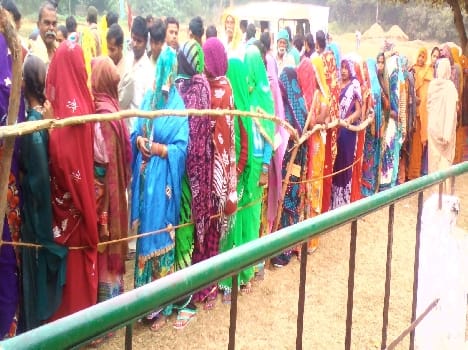 All out of the house of the village headman to choose