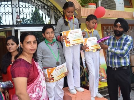 The award-winning children, wear gold medal