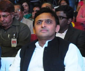 Akhilesh Yadav gives award to students and women.