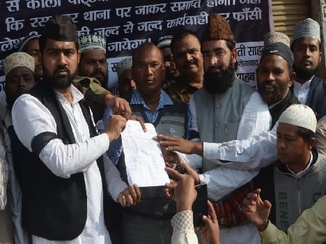 Muslims march out, handed the memorandum