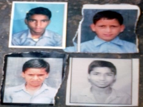 four boys run to school