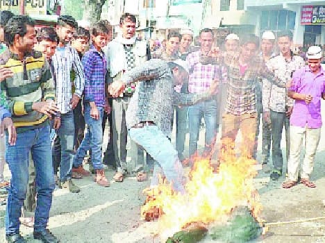 Burnt effigies, silent marches