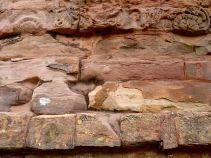 Dhamekh stupa wall extends from erosion concerns in sarnath.