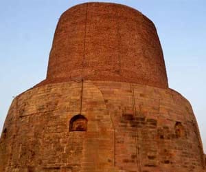 Dhamekh stupa wall extends from erosion concerns in sarnath.