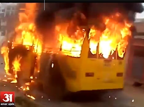 Video: Bus set fire after bike collision, safely rescued children