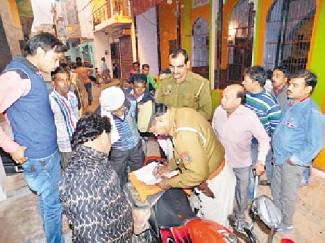 Woman chained looted from fire