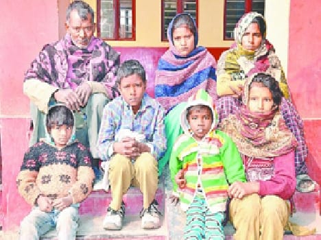 Family sitting on the protest for justice