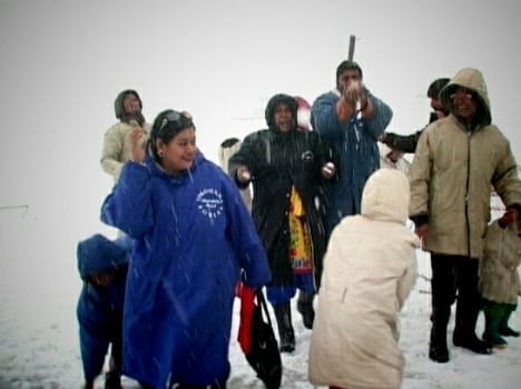 tourists enjoy snowfall in gulmarg
