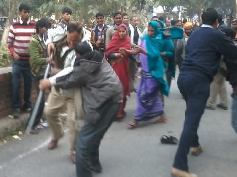 Women protesters beaten Provost , batons