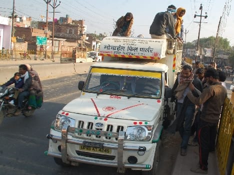 Passengers carry a mobile fish parlor vehicle