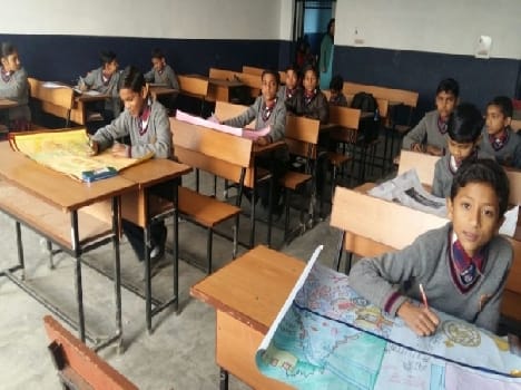 Rashmi in essay writing, poster Dinesh Marie stake