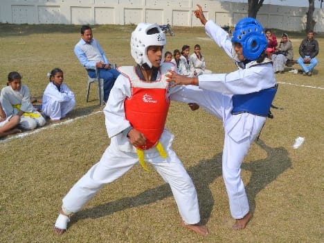Girls taekwondo competition in stadium