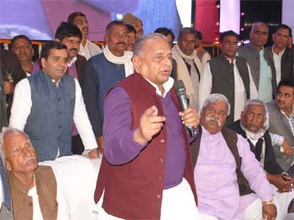 mulayam singh guides his son akhilesh 